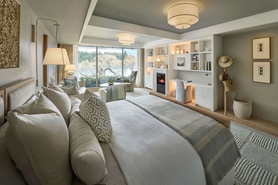 Luxury suite with separate lounge, fireplace and panoramic windows framing The Remarkables